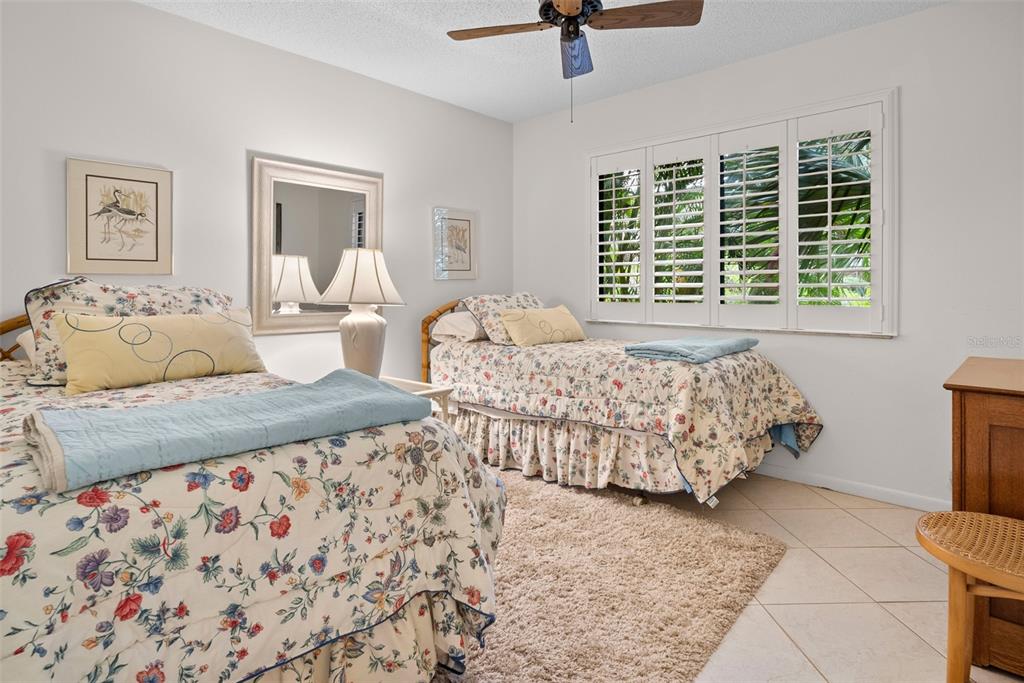 1703 Pelican Cove Road, Unit 356 Sarasota, FL 34231 - Photo 15 of 51 a bedroom with bed and a window