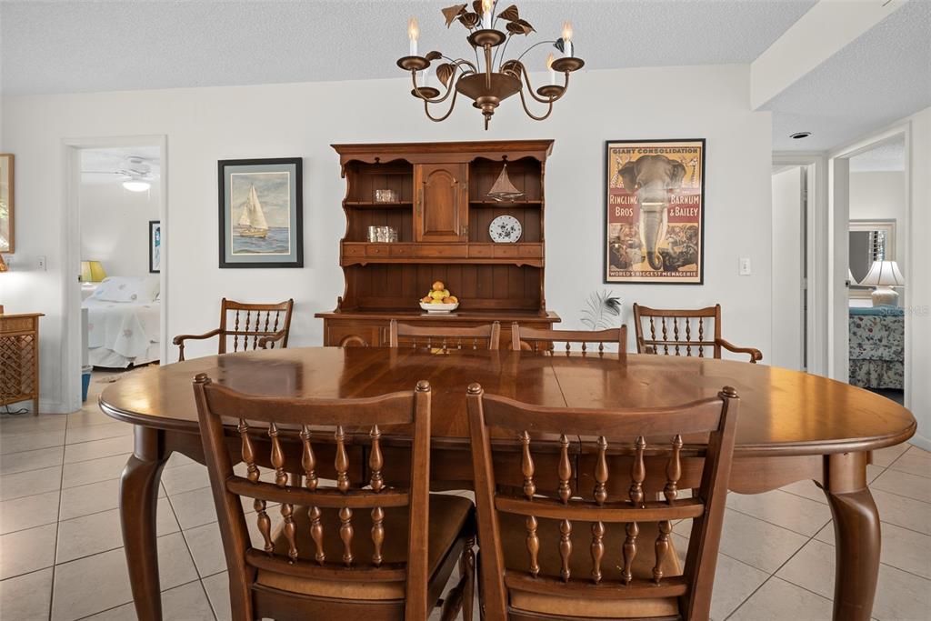 1703 Pelican Cove Road, Unit 356 Sarasota, FL 34231 - Photo 19 of 51 a view of a dining room with furniture