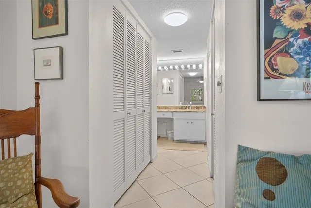 a bathroom with a granite countertop sink a toilet and a mirror