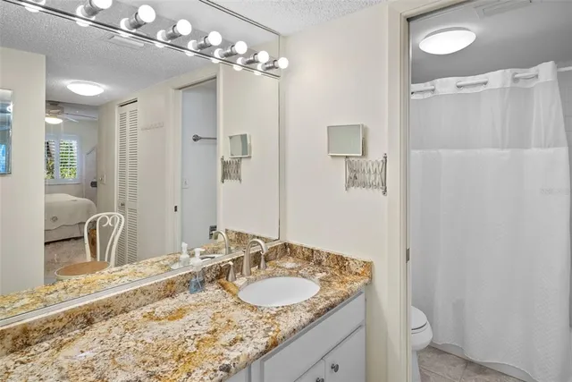 a bath room with a toilet and a bath tub