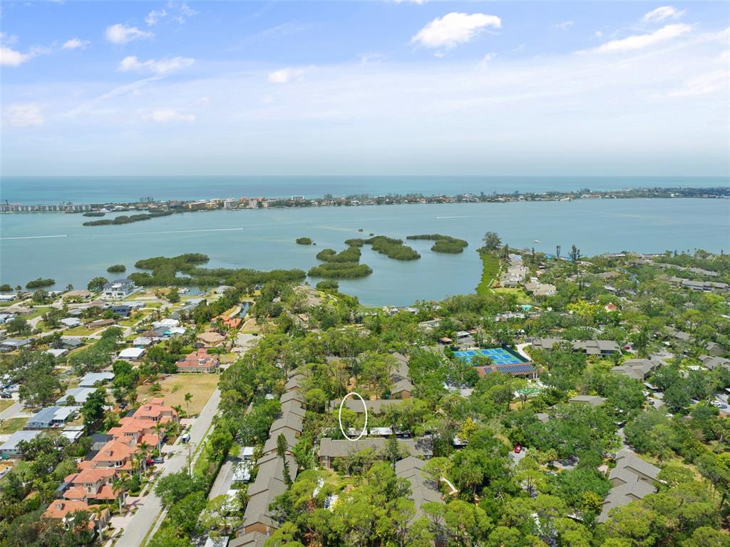 1703 Pelican Cove Road, Unit 356 Sarasota, FL 34231 - Photo 4 of 51 a aerial view of a houses with ocean view