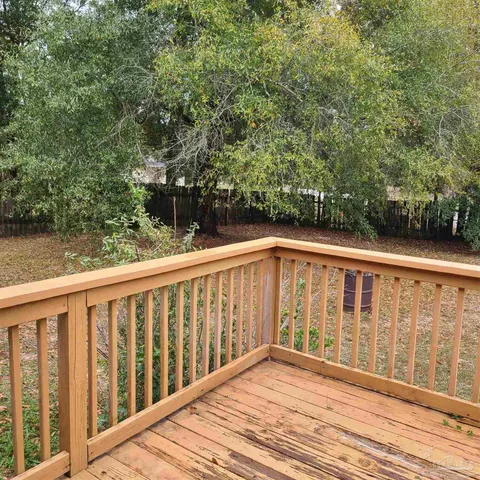 a view of balcony with wooden floor