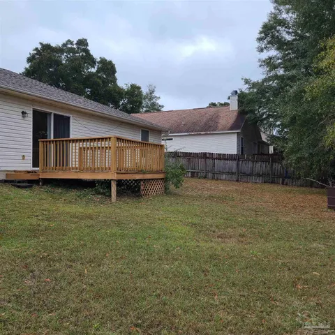 a backyard of a house with lots of green space