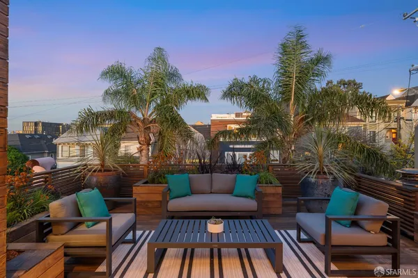 a front view of house with outdoor seating