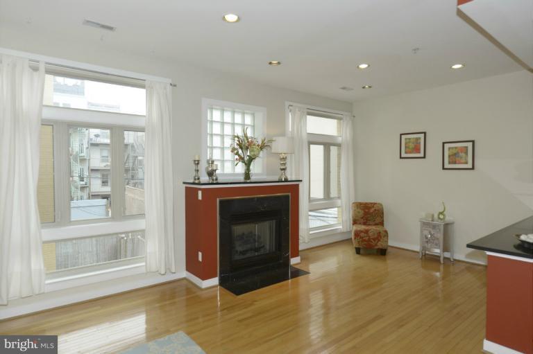 2363 Champlain Street Northwest, Unit 25 Washington, DC 20009 - Photo 6 of 30 Floor to Ceiling Windows & Gas Fireplace