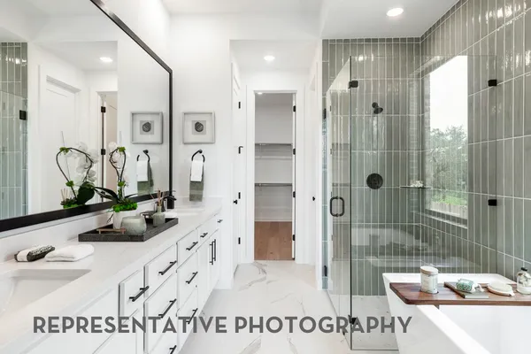 a bathroom with a double vanity sink and mirror