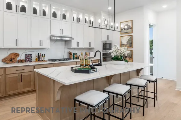 a kitchen with a sink cabinets and window