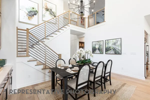 a view of a dining room with furniture and window
