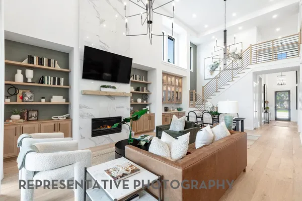 a living room with fireplace furniture and a flat screen tv