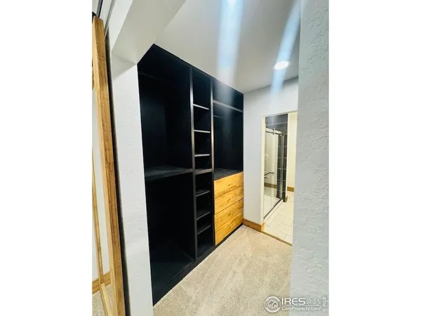 a view of walk in closet with large window