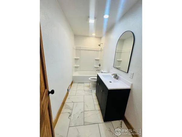 a bathroom with a sink and mirror