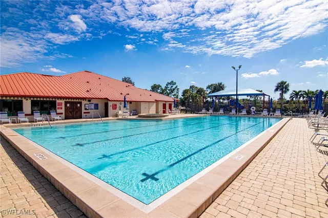 a view of swimming pool with a yard