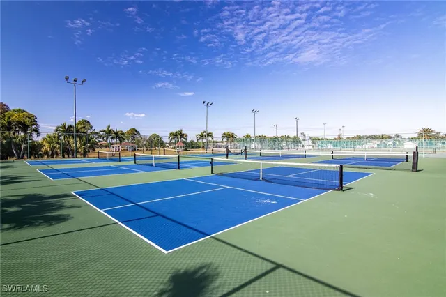 a view of an outdoor space and tennis court
