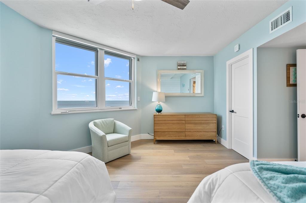 1050 Longboat Club Road, Unit 901 Longboat Key, FL 34228 - Photo 24 of 37 a bedroom with a bed and a couch