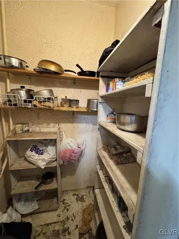 a stove top oven sitting inside of a kitchen
