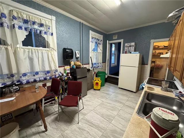 a room with furniture a rug and a window