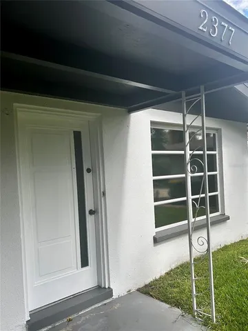 a view of wooden door and wooden floor