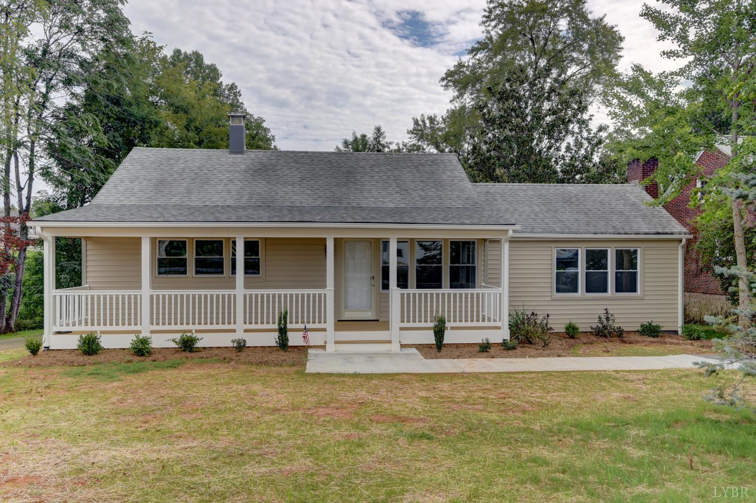 a front view of house with yard outdoor seating and barbeque oven