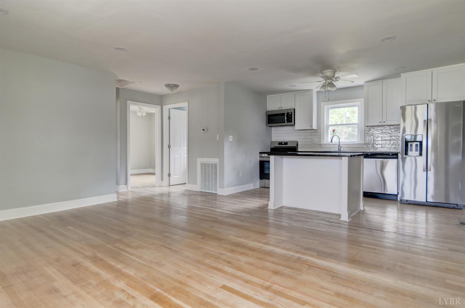 4724 Old Boonsboro Road Lynchburg, VA 24503 - Photo 11 of 39 a kitchen with stainless steel appliances a refrigerator and a stove top oven
