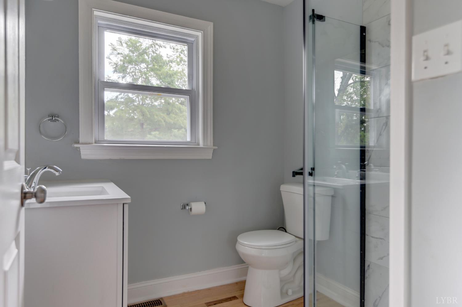 4724 Old Boonsboro Road Lynchburg, VA 24503 - Photo 12 of 39 a bathroom with a toilet a sink and shower
