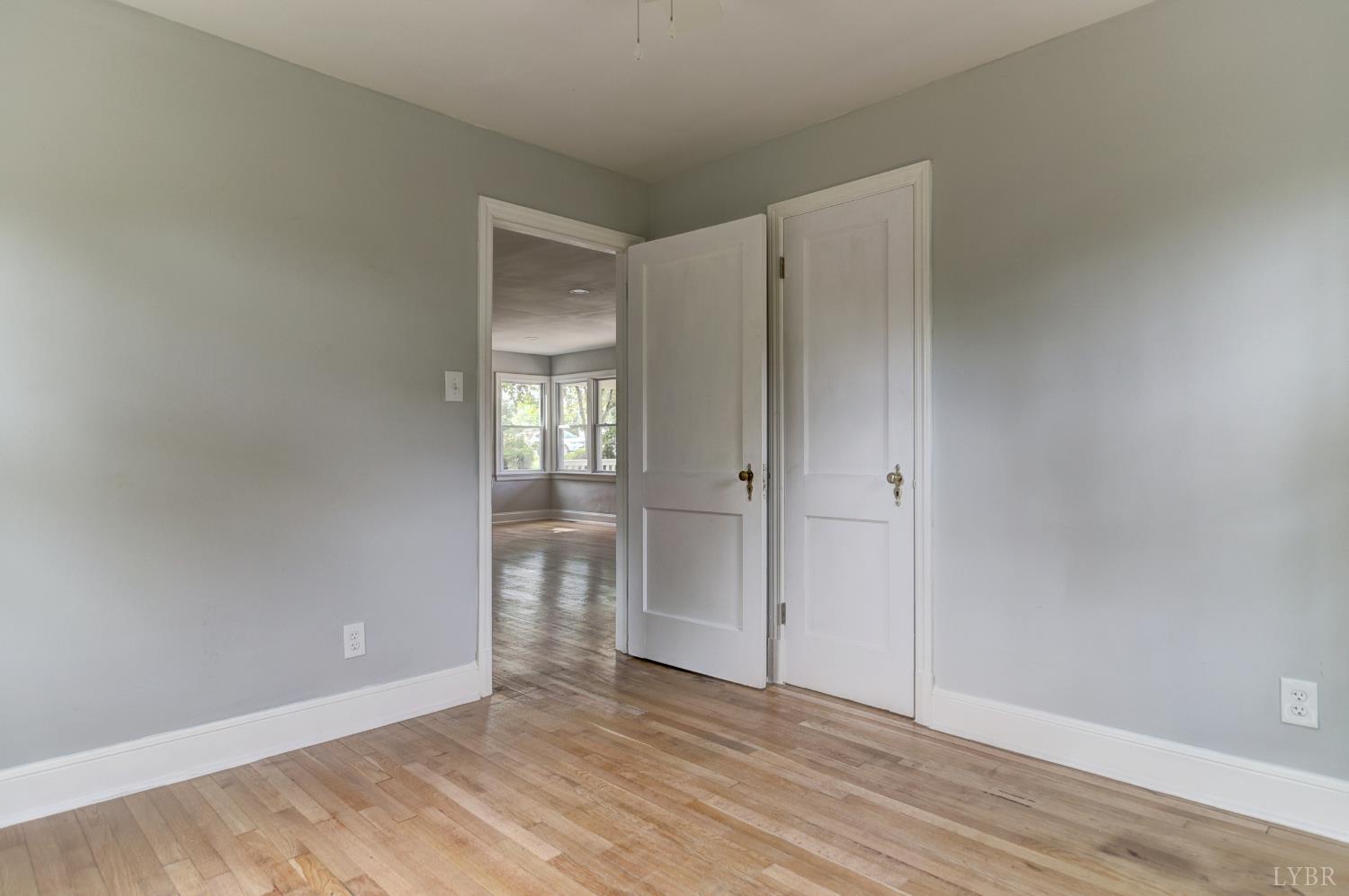4724 Old Boonsboro Road Lynchburg, VA 24503 - Photo 14 of 39 a view of an empty room with window and wooden floor