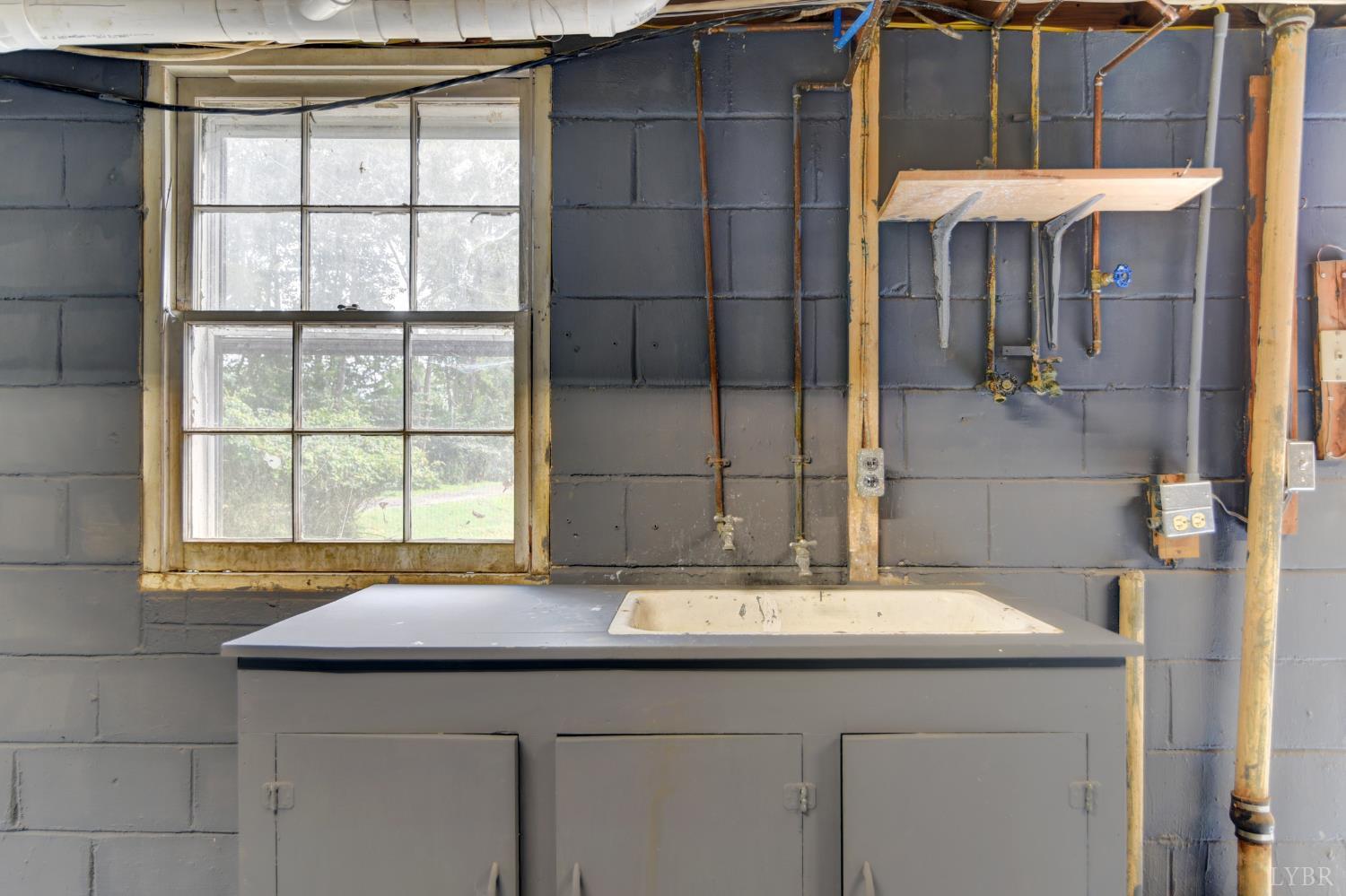 4724 Old Boonsboro Road Lynchburg, VA 24503 - Photo 30 of 39 a bathroom with a sink and a mirror