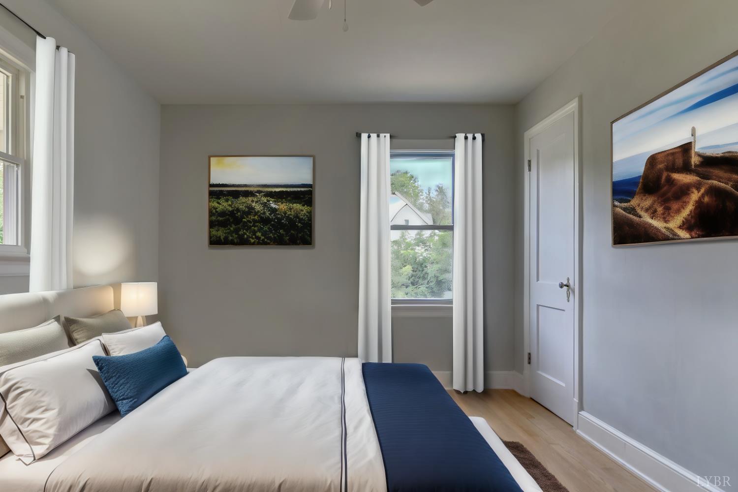 4724 Old Boonsboro Road Lynchburg, VA 24503 - Photo 38 of 39 a bedroom with a bed and wooden floor