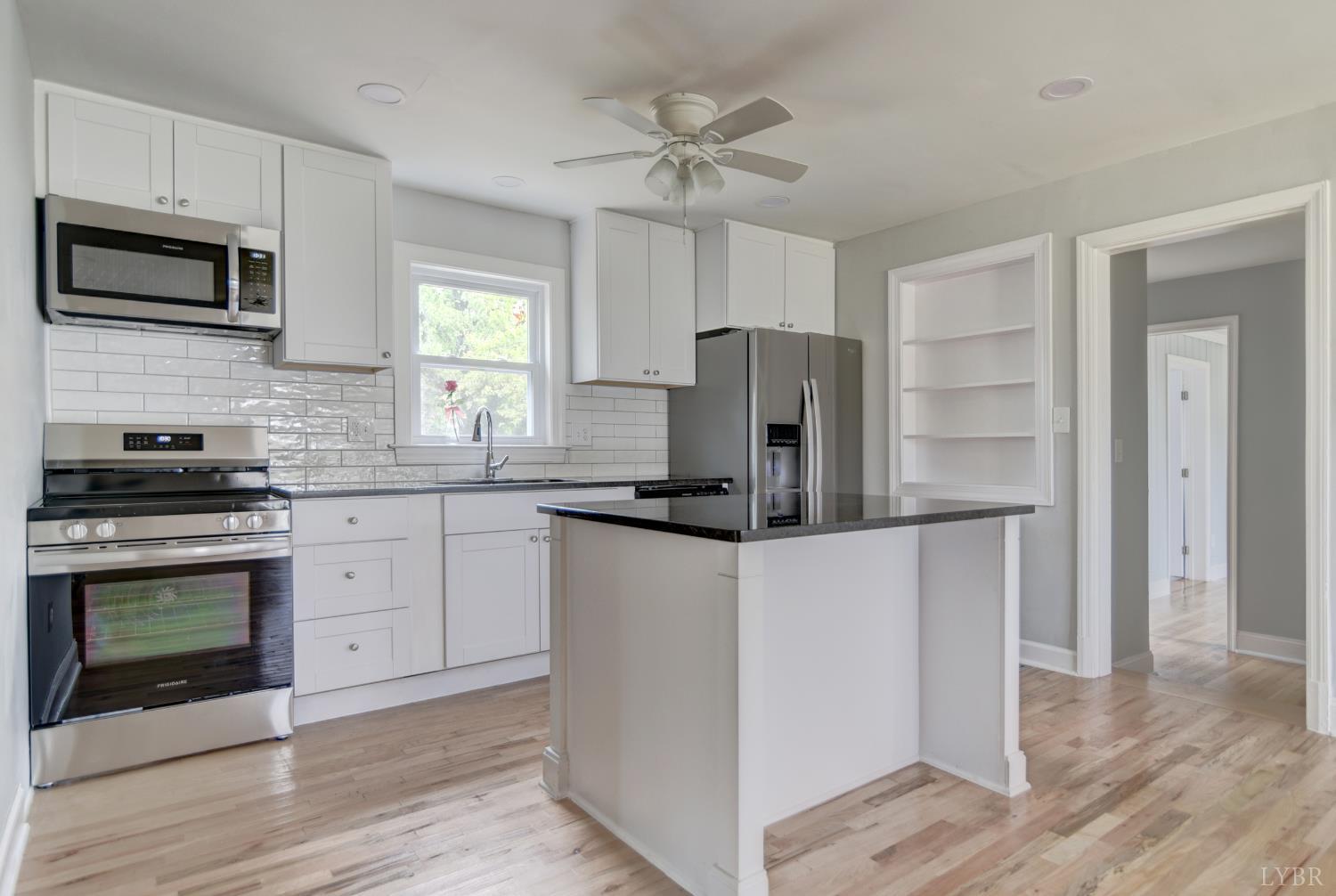 4724 Old Boonsboro Road Lynchburg, VA 24503 - Photo 9 of 39 a kitchen with stainless steel appliances a refrigerator stove and microwave