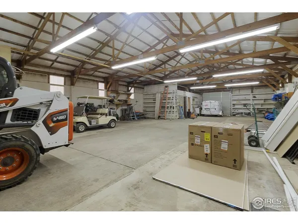 a view of parking garage with cars