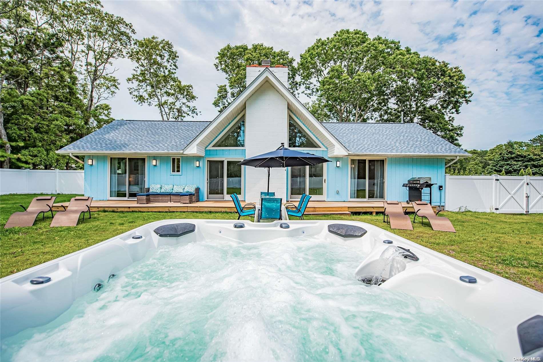 27 Norwood Road Hampton Bays, NY 11946 - Photo 1 of 1 View of the home from the hot tub.
