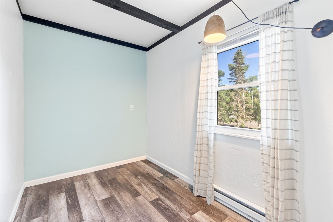 8011 Ryan Gulch Road, Unit B2 Silverthorne, CO 80498 - Photo 14 of 27 a view of a small space with wooden floor and a window