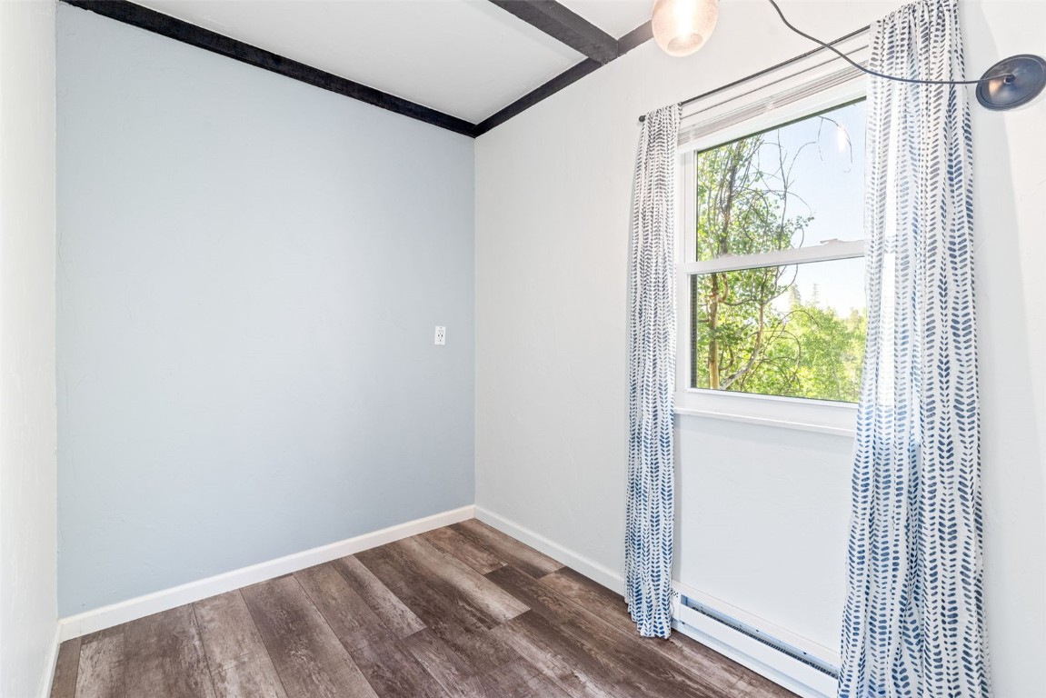 8011 Ryan Gulch Road, Unit B2 Silverthorne, CO 80498 - Photo 18 of 27 a view of a small space with wooden floor and a window