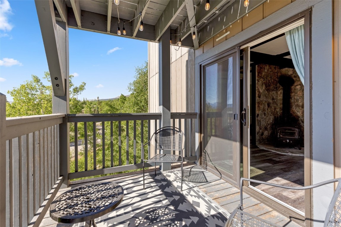 8011 Ryan Gulch Road, Unit B2 Silverthorne, CO 80498 - Photo 23 of 27 a view of a balcony with wooden floor