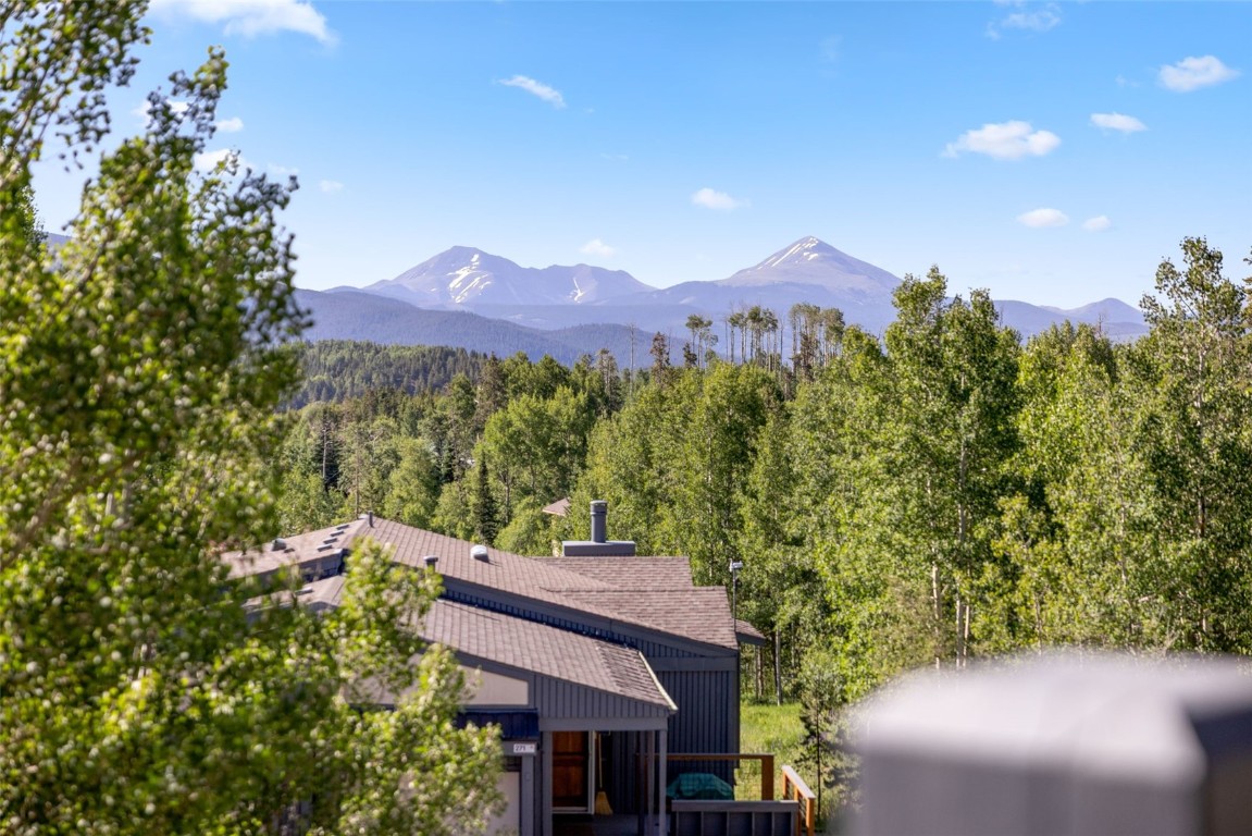 8011 Ryan Gulch Road, Unit B2 Silverthorne, CO 80498 - Photo 24 of 27 a view of a house with a mountain