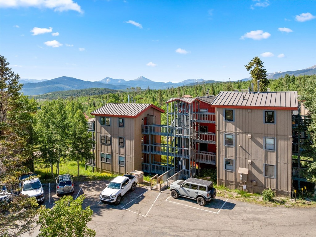 8011 Ryan Gulch Road, Unit B2 Silverthorne, CO 80498 - Photo 26 of 27 a car parked in front of a house