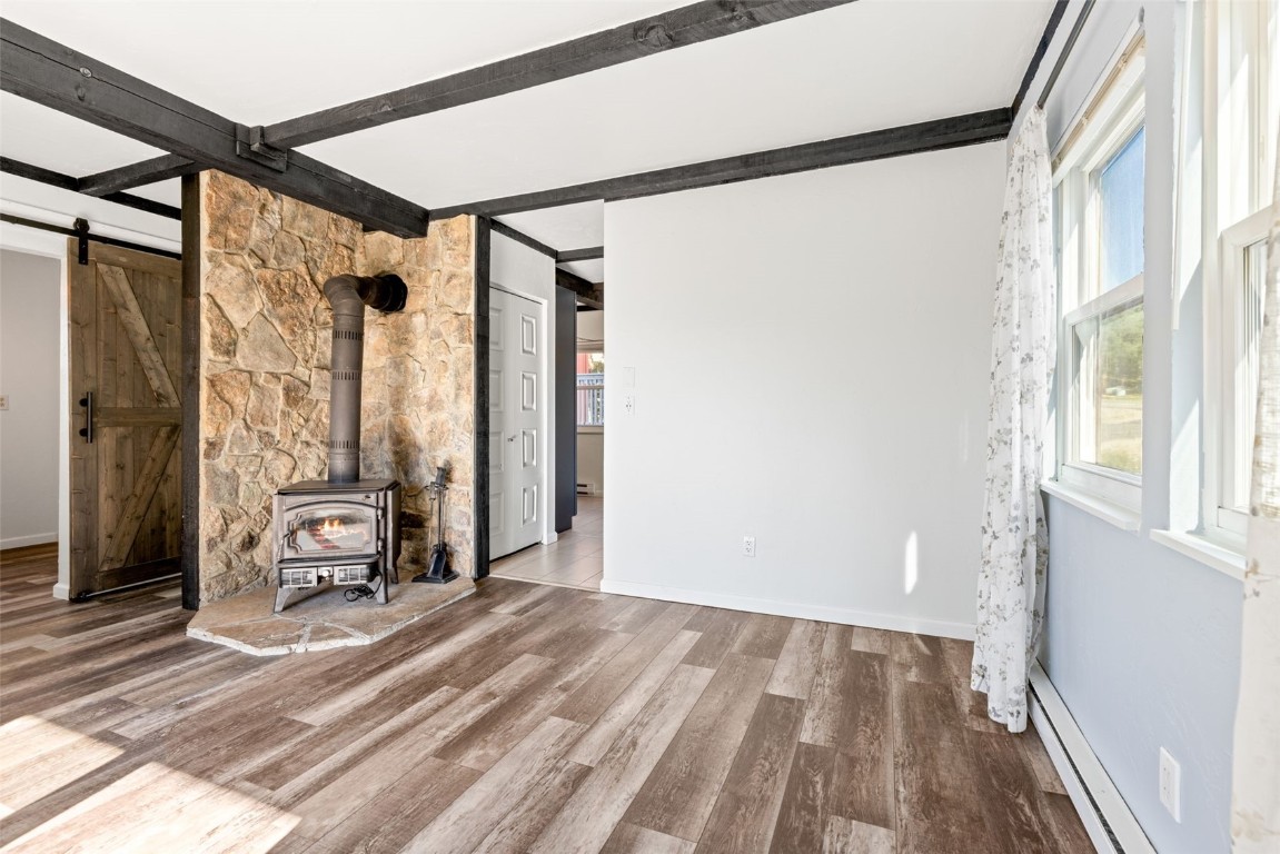 8011 Ryan Gulch Road, Unit B2 Silverthorne, CO 80498 - Photo 7 of 27 a view of a room with wooden floor and furniture