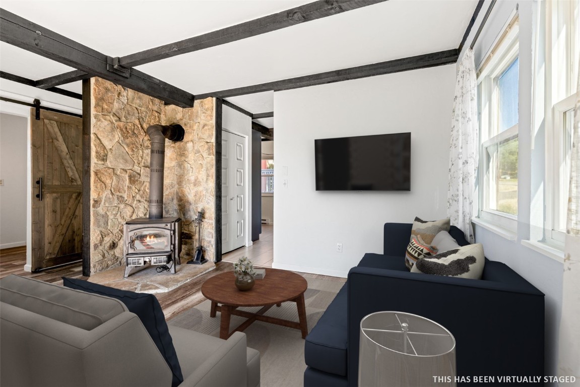 8011 Ryan Gulch Road, Unit B2 Silverthorne, CO 80498 - Photo 8 of 27 a living room with furniture and a flat screen tv