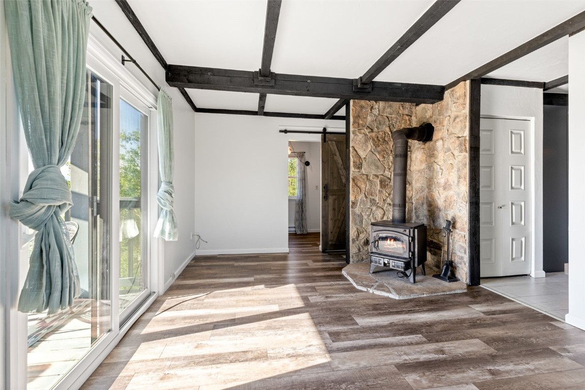 8011 Ryan Gulch Road, Unit B2 Silverthorne, CO 80498 - Photo 9 of 27 a view of a hallway with wooden floor and windows