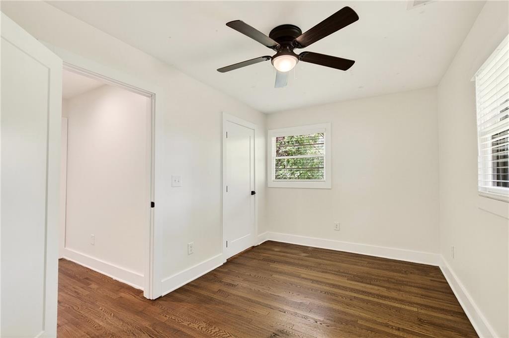 1344 Midlawn Drive Decatur, GA 30032 - Photo 65 of 87 an empty room with wooden floor and windows