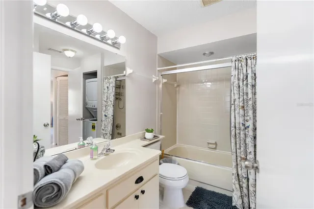 an aerial view of a house with a lake view