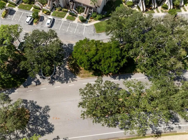 an aerial view of a house with yard swimming pool and outdoor seating