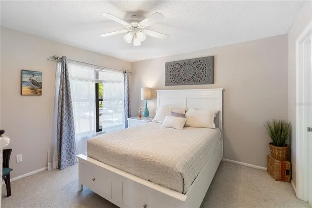 a living room with furniture and a lamp