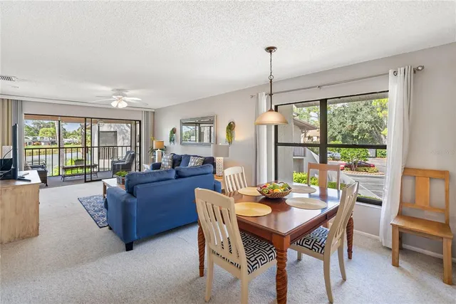 a kitchen with a refrigerator a stove a sink and cabinets
