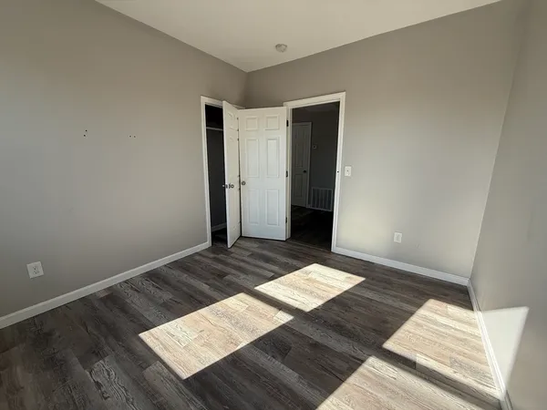 a view of wooden floor in an empty room