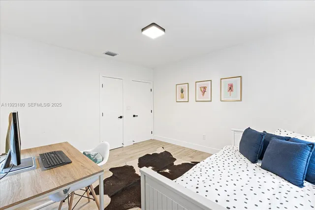 a bedroom with a bed and a table