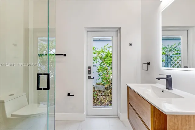 a bathroom with a sink and mirror