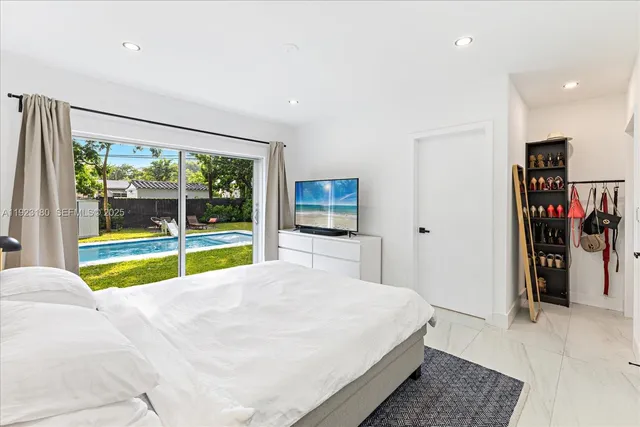 a bed room with a bed and a view of bedroom