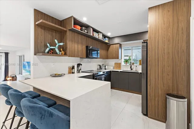 a kitchen with a refrigerator and a sink