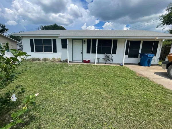 front view of a house with a yard