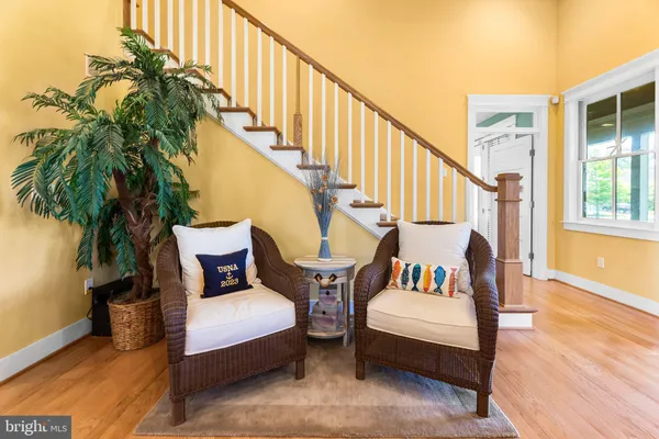a living room with furniture a window and a fireplace